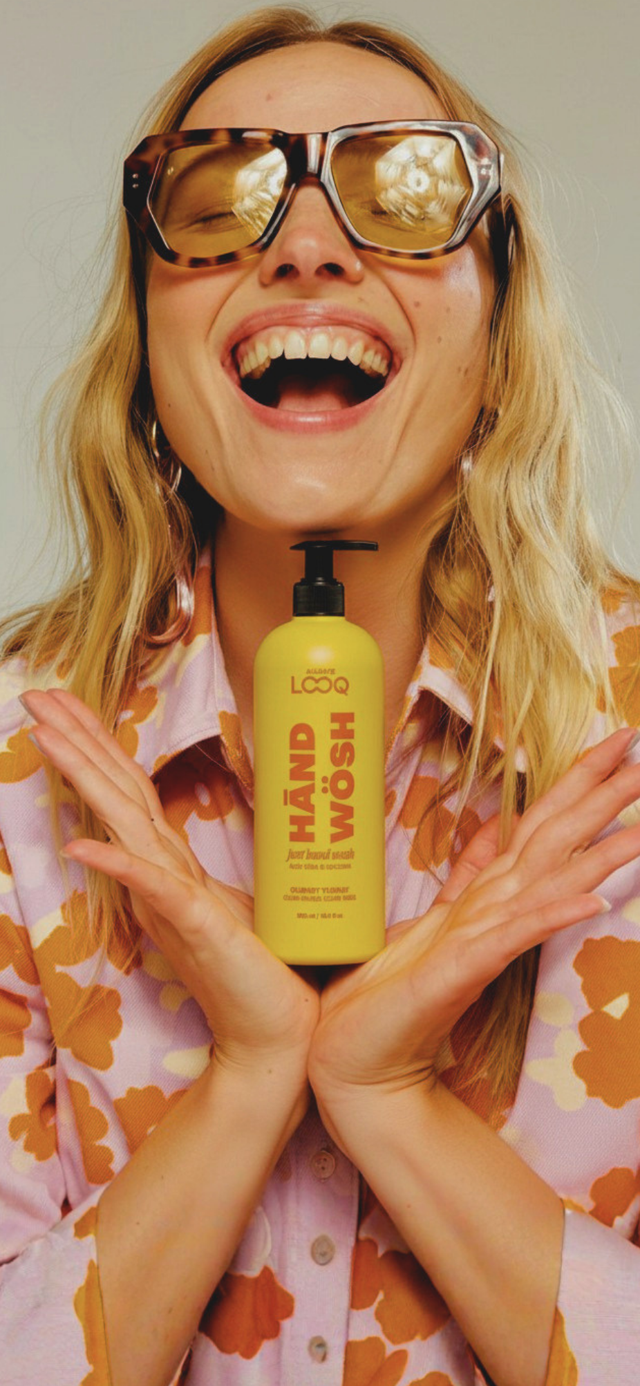 LOOQ hero — woman holding HĀND WÖSH